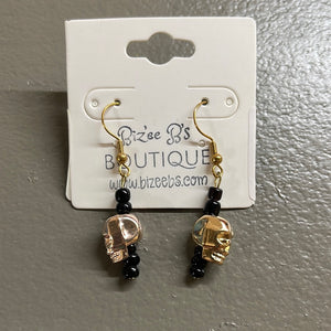 Gold skull earrings